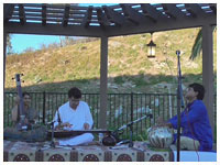 Accompanying Mohan Veena player Suman Laha at at 'East Meets West' concert, San Diego, CA