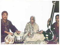 Accompanying Vidushi Padmabhushan Girija Devi at a concert in Irvine, CA